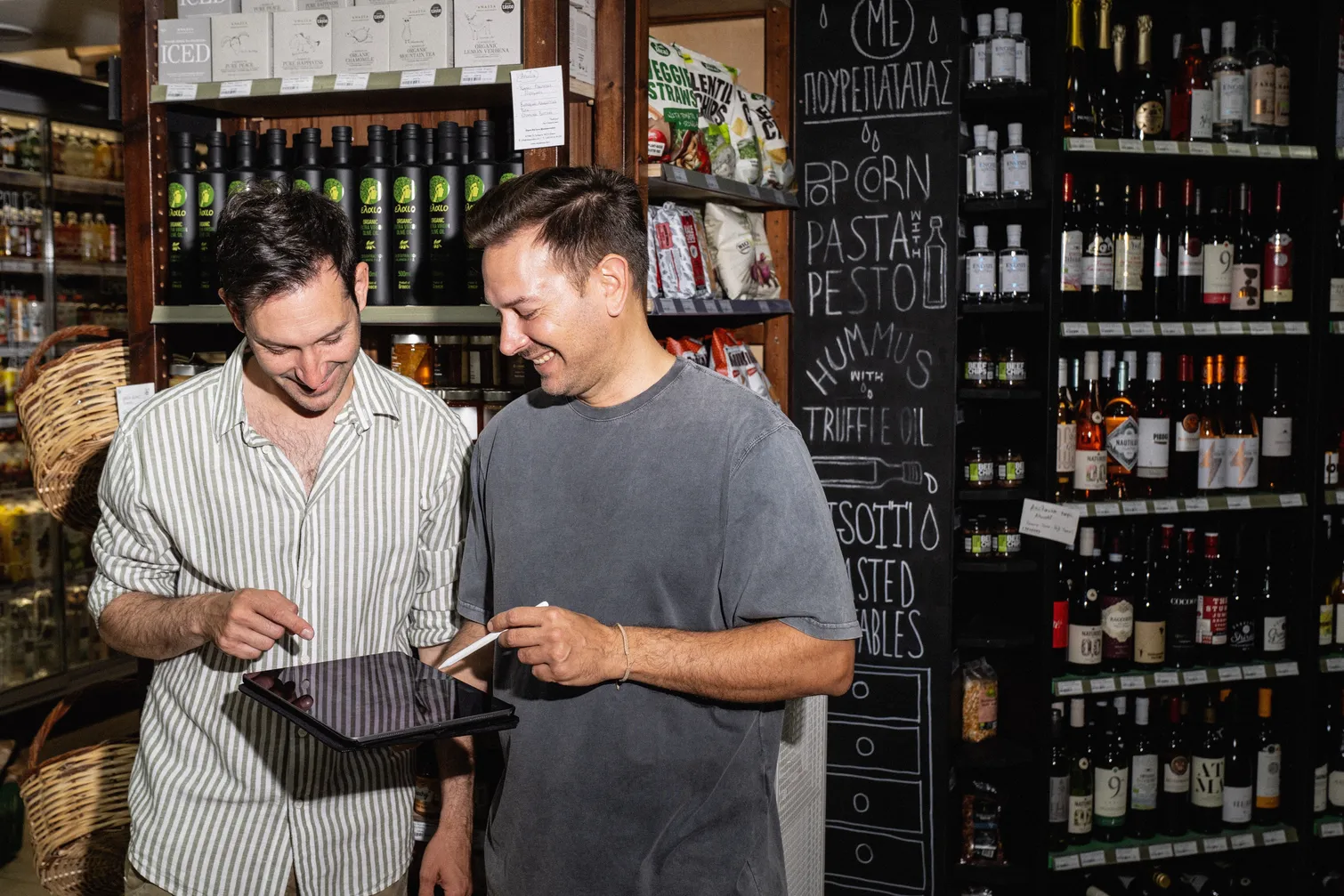 Vasilis and George Souvatzoglou in the aisle of their organic grocery